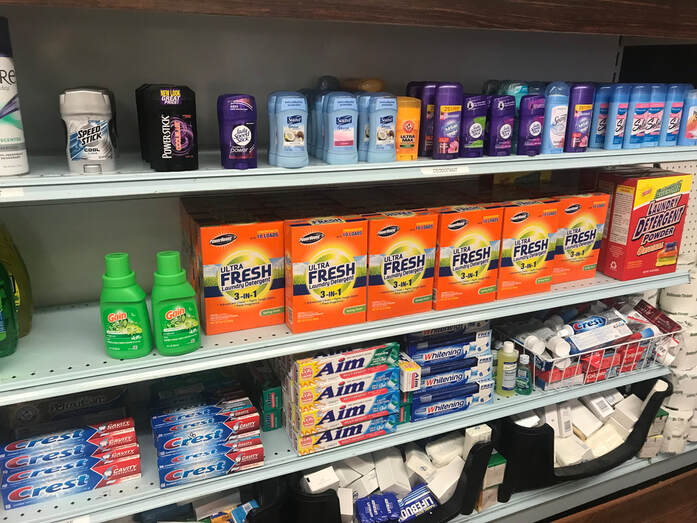 shelves of personal hygiene items at a food pantry